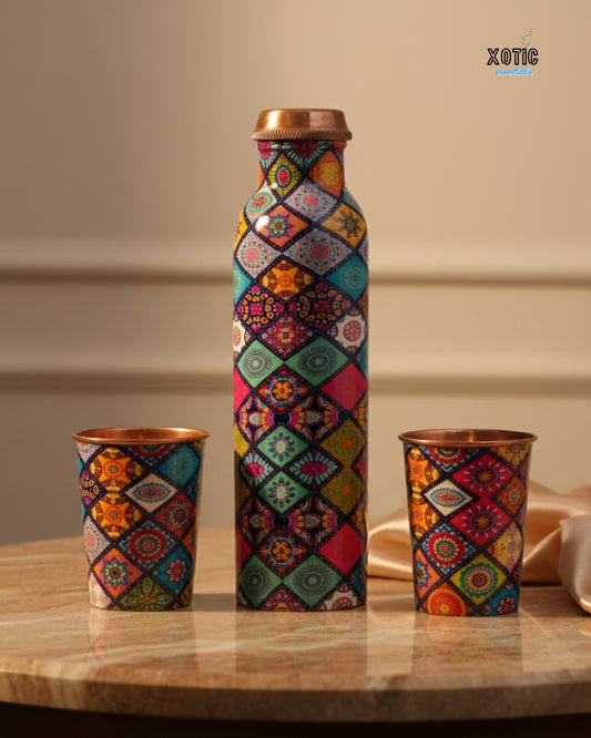Colorful patterned bottle and cups on a wooden surface with a neutral background