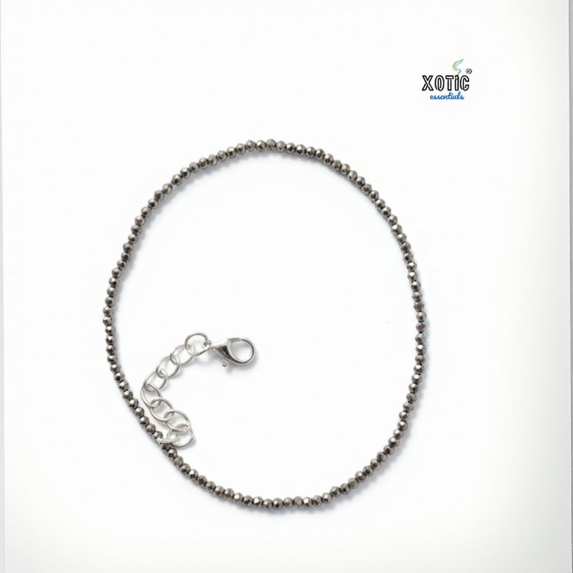 Silver beaded bracelet on a white background with 'Xotic' branding.